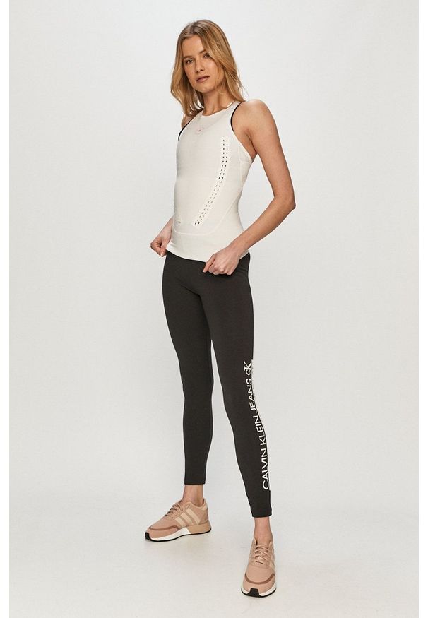 Calvin Klein Jeans - Legginsy. Kolor: czarny. Materiał: dzianina. Wzór: nadruk