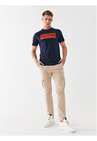 Guess Spodnie materiałowe M2GB27 WCNZ0 Beżowy Slim Fit. Kolor: beżowy. Materiał: bawełna, materiał