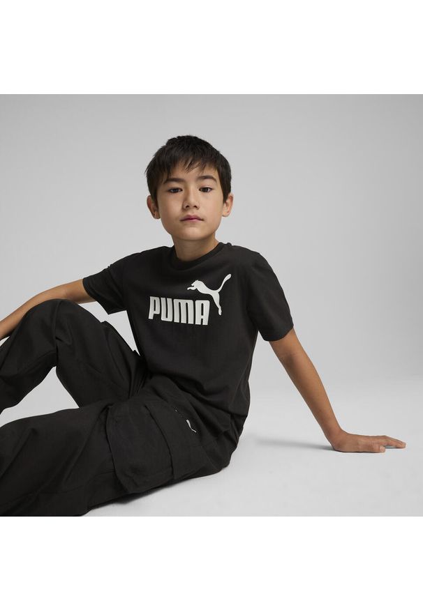 Puma - Młodzieżowa koszulka ESS z logo No. 1 PUMA Black. Kolor: czarny. Materiał: guma. Wzór: nadruk. Sport: joga i pilates
