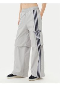 Adidas - adidas Spodnie dresowe Adibreak JJ3122 Szary Regular Fit. Kolor: szary. Materiał: syntetyk