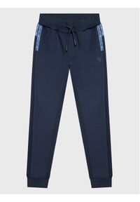 Guess Spodnie dresowe L3RQ15 JR06W Niebieski Relaxed Fit. Kolor: niebieski. Materiał: syntetyk