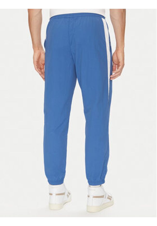 Reebok Spodnie dresowe 100215278 Niebieski Regular Fit. Kolor: niebieski. Materiał: syntetyk