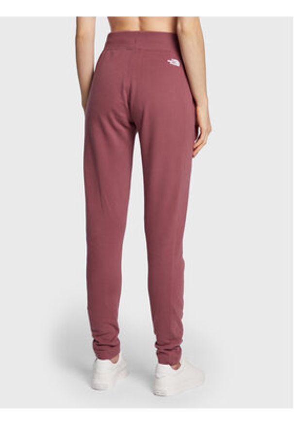 The North Face Spodnie dresowe W Nse NF0A55GS Bordowy Slim Fit. Kolor: czerwony. Materiał: dresówka, bawełna