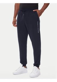 TOMMY HILFIGER - Tommy Hilfiger Spodnie dresowe UM0UM03664 Granatowy Regular Fit. Kolor: niebieski. Materiał: syntetyk, bawełna #1