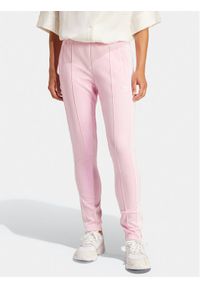 Adidas - adidas Spodnie dresowe adicolor SST IR8076 Różowy Slim Fit. Kolor: różowy. Materiał: bawełna, syntetyk