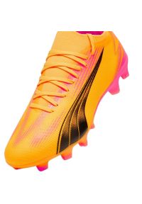 Buty piłkarskie Puma Ultra Match FG/AG 107754 03 pomarańczowe. Kolor: pomarańczowy. Szerokość cholewki: normalna. Sport: piłka nożna