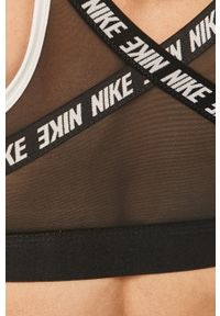 Nike - Biustonosz sportowy. Kolor: biały. Materiał: materiał, skóra, elastan, tkanina, nylon, poliester, włókno. Rodzaj stanika: wyciągane miseczki, odpinane ramiączka. Technologia: Dri-Fit (Nike). Wzór: nadruk #4