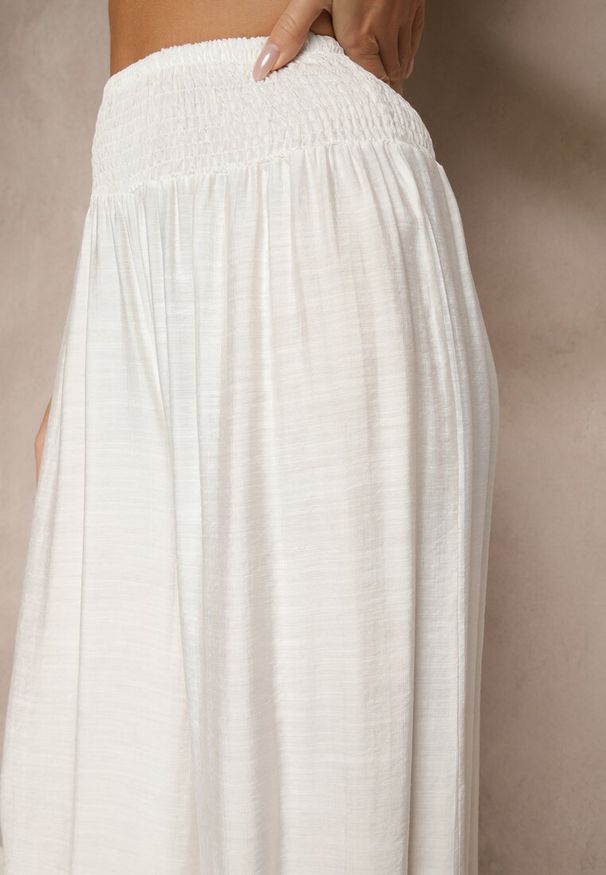 Renee - Jasnobeżowe Spodnie z Wiskozą o Szerokim Kroju High Waist Orrana. Okazja: na co dzień. Stan: podwyższony. Kolor: beżowy. Materiał: wiskoza. Styl: elegancki, casual