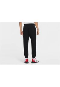 Spodnie sportowe męskie Nike Standard Issue. Kolor: czarny, beżowy, wielokolorowy. Materiał: dresówka