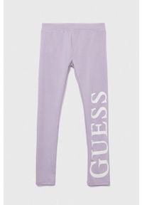 Guess legginsy dziecięce kolor fioletowy z nadrukiem. Kolor: fioletowy. Wzór: nadruk