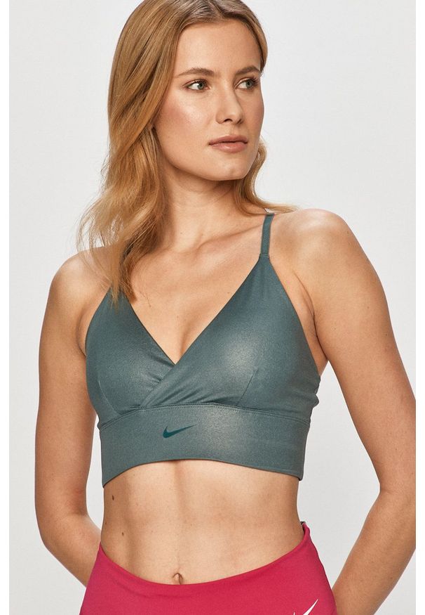 Nike - Biustonosz sportowy. Kolor: zielony. Rodzaj stanika: odpinane ramiączka, wyciągane miseczki