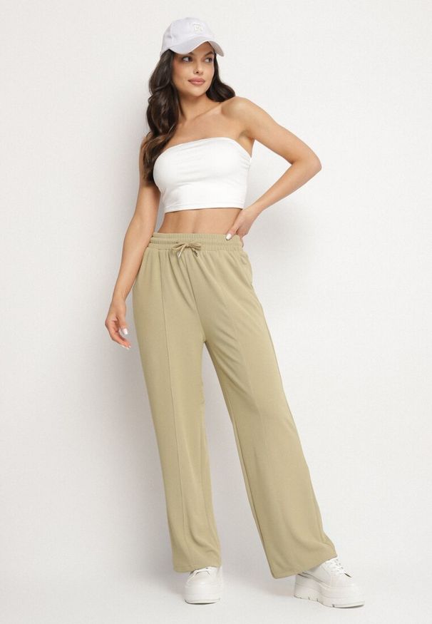 Born2be - Jasnozielone Szerokie Spodnie z Wysokim Stanem i Wiązaniem Deannie. Okazja: na spotkanie biznesowe, na co dzień. Stan: podwyższony. Kolor: zielony. Materiał: guma. Styl: elegancki, casual, klasyczny, biznesowy
