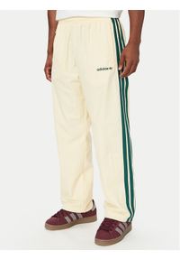 Adidas - adidas Spodnie dresowe Cutline Track Tracksuit Bottoms KW8021 Kremowy Regular Fit. Kolor: kremowy. Materiał: syntetyk #1