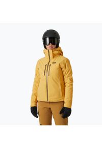 Kurtka narciarska damska Helly Hansen Alphelia Lifaloft sand. Kolor: żółty. Sezon: zima. Sport: narciarstwo