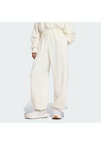 Adidas - Spodnie ALL SZN Soft Lux Loose. Kolor: biały