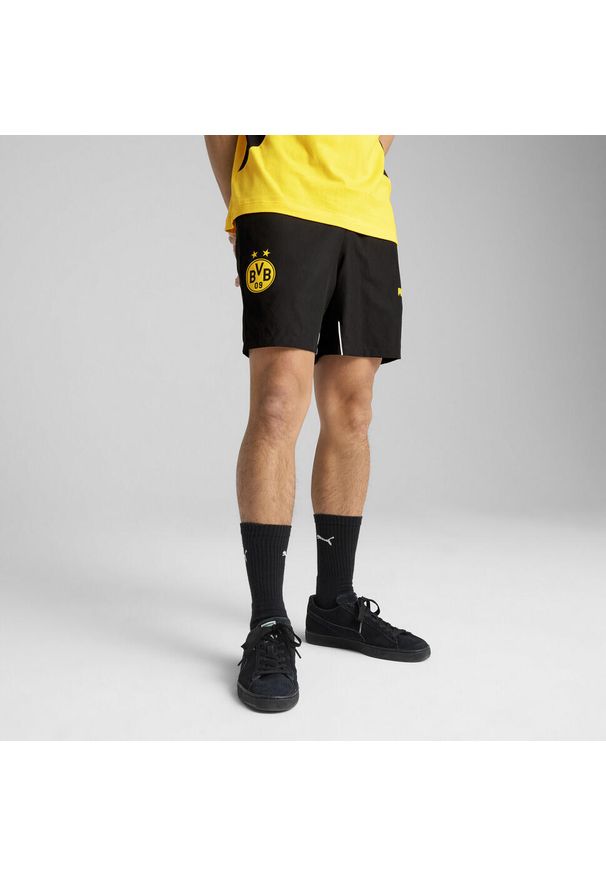 Puma - Męskie szorty Borussia Dortmund ftblARCHIVE PUMA Black Faster Yellow. Kolor: czarny, wielokolorowy, żółty. Wzór: aplikacja. Sport: piłka nożna