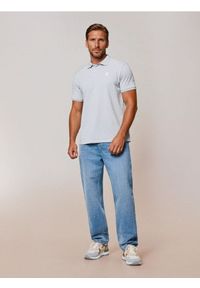 Sinsay - Bawełniane polo z haftem - zielony. Typ kołnierza: polo. Kolor: zielony. Materiał: bawełna. Wzór: haft