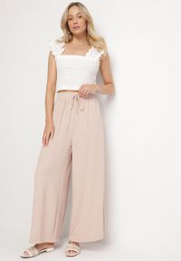 Born2be - Beżowe Szerokie Spodnie Typu Palazzo z Wiązaniem Ulialitia. Okazja: na co dzień. Stan: podwyższony. Kolor: beżowy. Styl: elegancki, casual #7