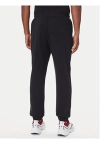 TOMMY HILFIGER - Tommy Hilfiger Spodnie dresowe UM0UM03664 Czarny Regular Fit. Kolor: czarny. Materiał: bawełna