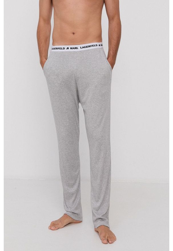 Karl Lagerfeld Spodnie piżamowe 215M2182 męskie kolor szary gładka. Kolor: szary. Materiał: bawełna, materiał, dzianina, lyocell, tkanina, jedwab. Wzór: gładki