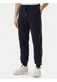 TOMMY HILFIGER - Tommy Hilfiger Spodnie dresowe Global Stripe MW0MW42882 Niebieski Regular Fit. Kolor: niebieski. Materiał: bawełna #1