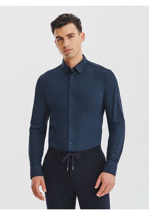 Pako Lorente - PAKO LORENTE – Granatowa dzianinowa koszula męska. Typ kołnierza: kołnierzyk klasyczny. Kolor: niebieski, czarny. Materiał: dzianina. Długość rękawa: długi rękaw. Długość: długie. Wzór: gładki. Styl: klasyczny