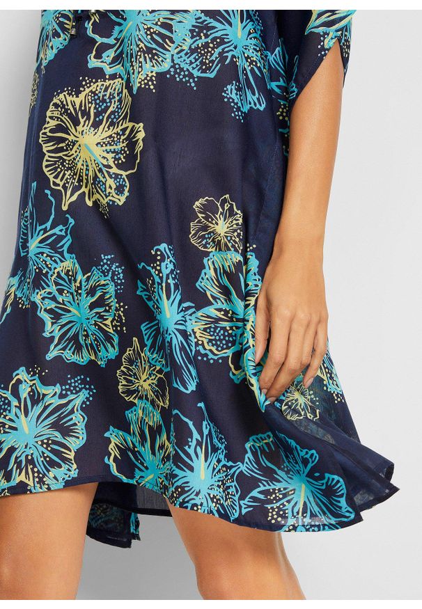 bonprix - Prześwitująca tunika plażowa z dekoltem w serek. Okazja: na plażę. Typ kołnierza: dekolt w serek. Kolor: niebieski. Materiał: materiał. Wzór: kwiaty, nadruk. Styl: elegancki