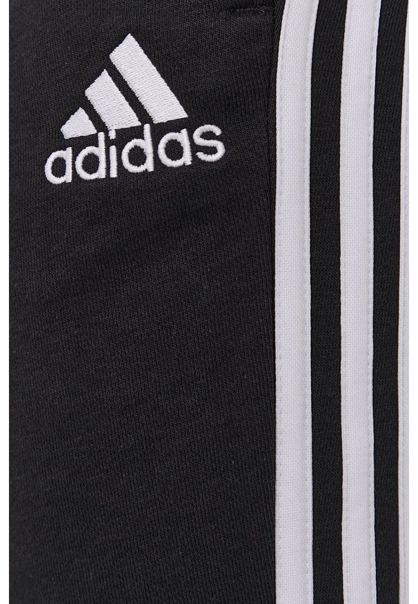 Adidas - adidas Spodnie męskie kolor czarny gładkie. Kolor: czarny. Materiał: dzianina, poliester. Wzór: gładki