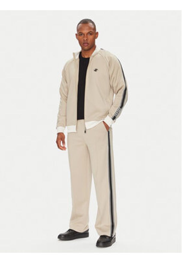 Guess Spodnie dresowe Z5YB14 KCRU2 Beżowy Regular Fit. Kolor: beżowy. Materiał: syntetyk