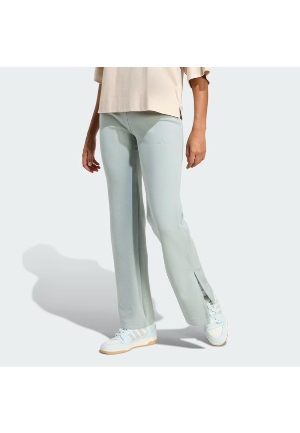 Adidas - Spodnie Soft Lux Flared. Kolor: zielony. Sport: fitness