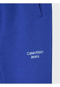 Calvin Klein Jeans Spodnie dresowe Stack Logo IB0IB01282 Granatowy Regular Fit. Kolor: niebieski. Materiał: bawełna