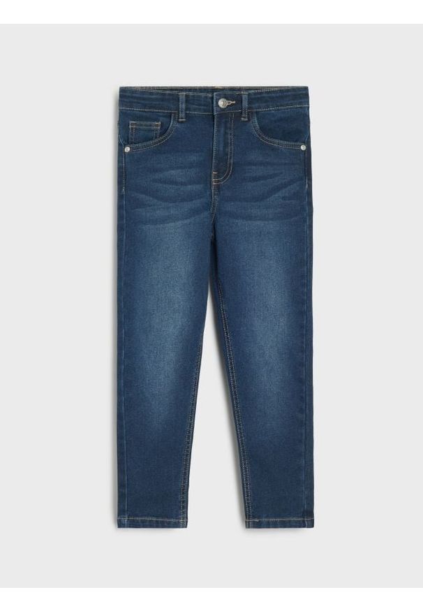 Sinsay - Spodnie jeansowe slim fit - granatowy. Kolor: niebieski