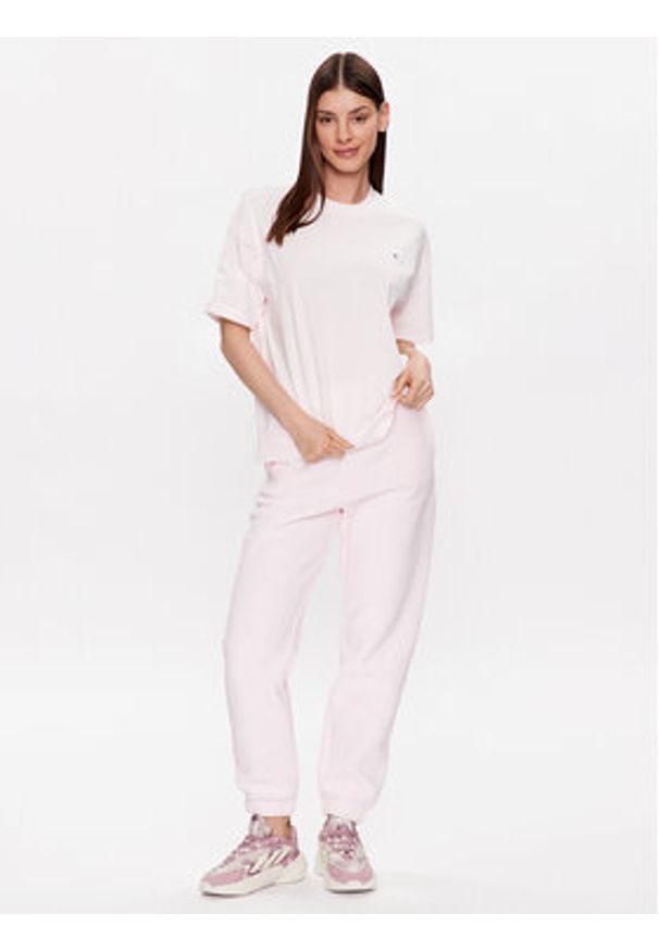 Champion Spodnie dresowe 116243 Różowy Regular Fit. Kolor: różowy. Materiał: bawełna