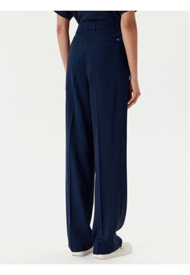 TOMMY HILFIGER - Tommy Hilfiger Spodnie materiałowe WW0WW46749 Granatowy Relaxed Fit. Kolor: niebieski. Materiał: wiskoza