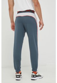 Puma spodnie dresowe męskie wzorzyste. Kolor: szary. Materiał: dresówka #4