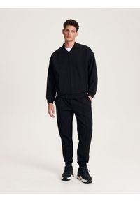 Reserved - Spodnie jogger slim - czarny. Kolor: czarny. Materiał: dzianina, bawełna