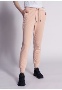 Spodnie dresowe damskie różowe Armani Exchange 8NYP97 YJ1GZ 14AA. Kolor: czarny. Materiał: dresówka