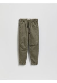 Reserved - Wysokoelastyczne spodnie jogger - jasny zielony. Kolor: zielony. Materiał: tkanina, bawełna #1