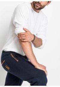 bonprix - Spodnie sportowe z praktycznymi kieszeniami zapinanymi na zamek. Kolor: niebieski. Styl: sportowy #3