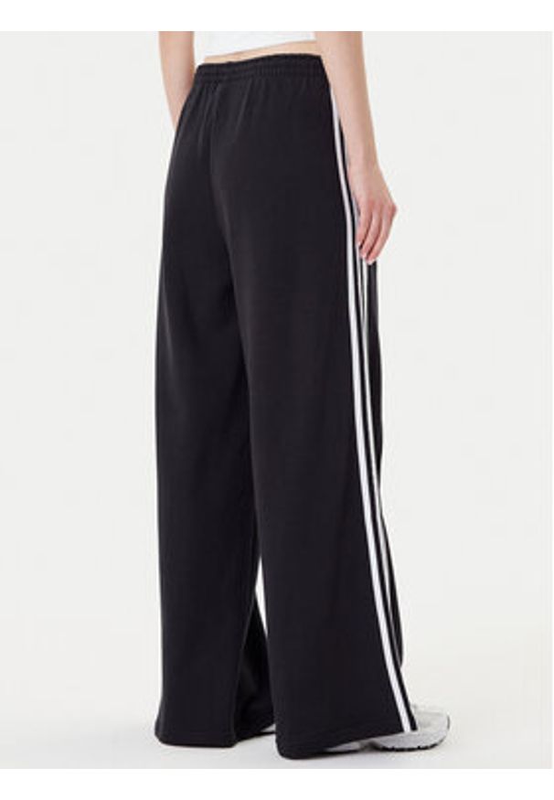 Adidas - adidas Spodnie dresowe adicolor 3-Stripes JV7473 Czarny Wide Leg. Kolor: czarny. Materiał: bawełna