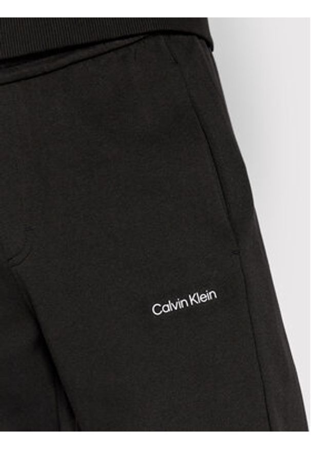 Calvin Klein Spodnie dresowe Micro Logo K10K109940 Czarny Relaxed Fit. Kolor: czarny. Materiał: bawełna, syntetyk