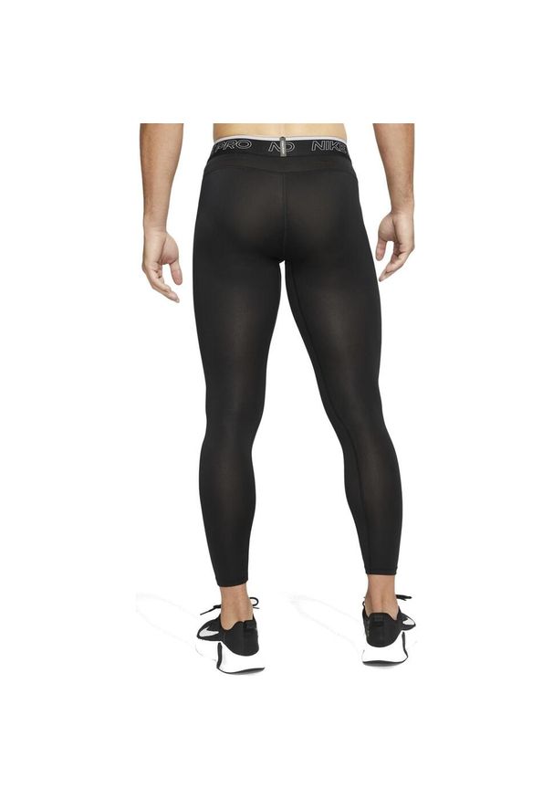 Spodnie treningowe męskie Nike Pro Drifit Tight. Kolor: czarny, biały, wielokolorowy. Materiał: poliester. Sport: bieganie