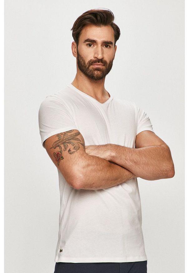 Lacoste - T-shirt. Okazja: na co dzień. Kolor: biały. Materiał: dzianina. Wzór: gładki. Styl: casual