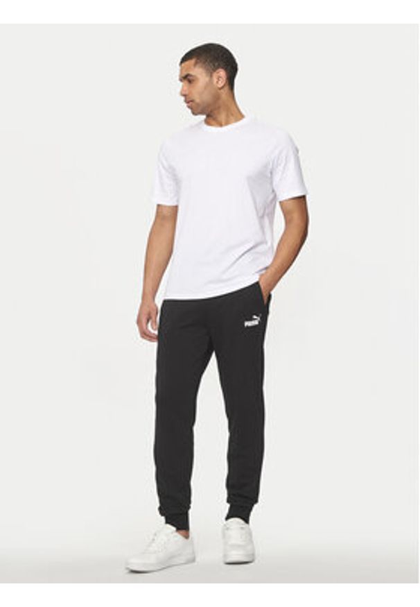Puma Spodnie dresowe Ess Logo 586716 Czarny Regular Fit. Kolor: czarny. Materiał: bawełna, syntetyk