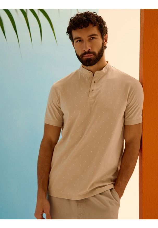 Sinsay - Bawełniana koszulka polo - kremowy. Typ kołnierza: polo. Kolor: kremowy. Materiał: bawełna