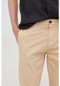 Hugo - HUGO spodnie męskie kolor beżowy dopasowane. Kolor: beżowy. Materiał: tkanina