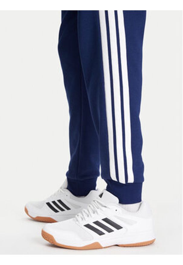 Adidas - adidas Spodnie dresowe Essentials 3-Stripes JD1859 Niebieski Regular Fit. Kolor: niebieski. Materiał: syntetyk