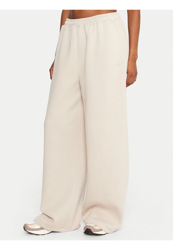 Reebok Spodnie dresowe Reebok X Ewa Chodakowska RK25306CCW Beżowy Regular Fit. Kolor: beżowy. Materiał: bawełna, syntetyk