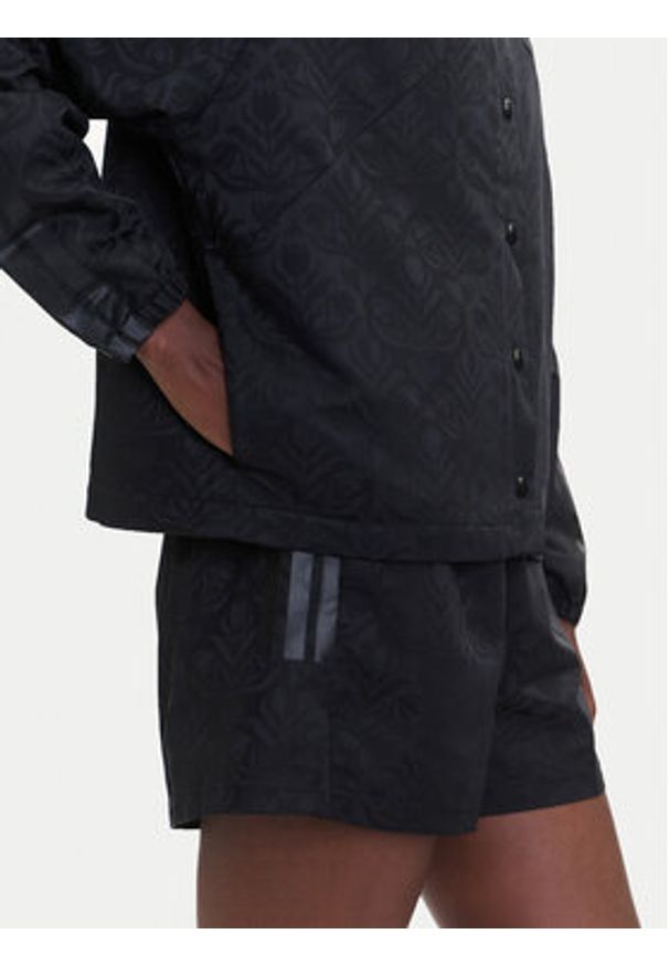Adidas - adidas Kurtka przejściowa Tiro x Common Goal Coaches JL7647 Czarny Loose Fit. Kolor: czarny. Materiał: syntetyk