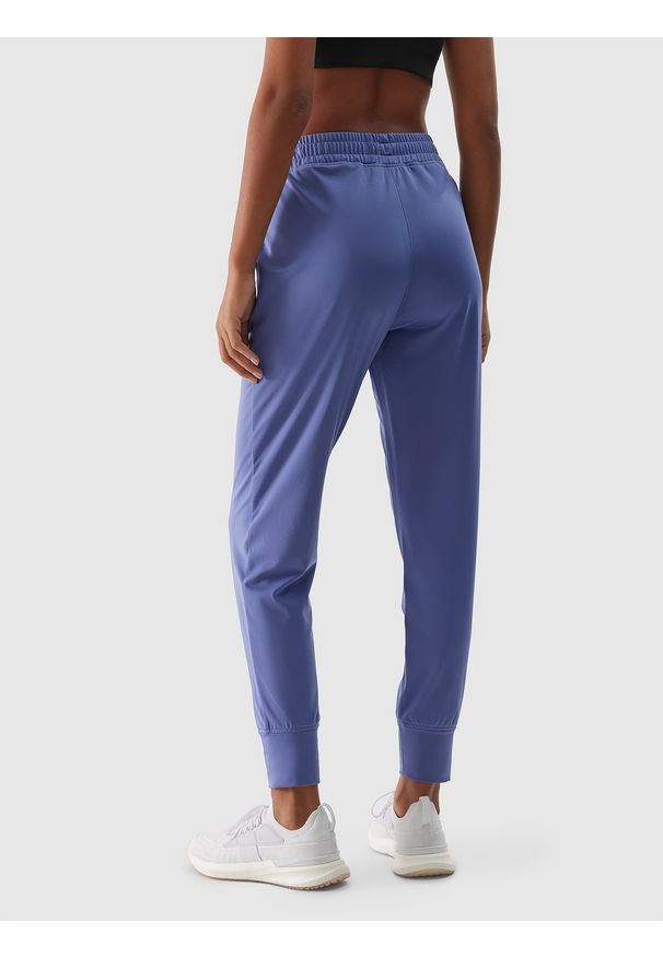4f - 4F Spodnie treningowe szybkoschnące damskie - granatowe XL. Kolor: niebieski. Materiał: dzianina, elastan, włókno, syntetyk, materiał. Wzór: jednolity, ze splotem. Sport: fitness